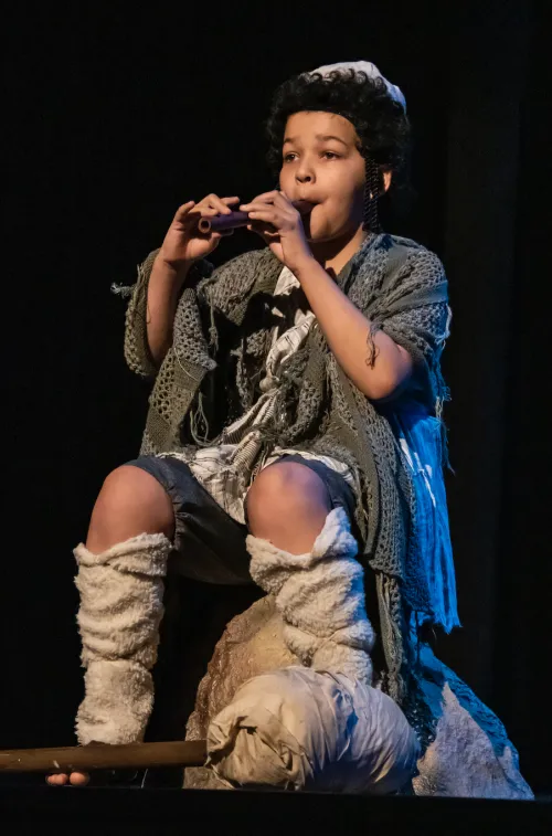 boy playing pipe